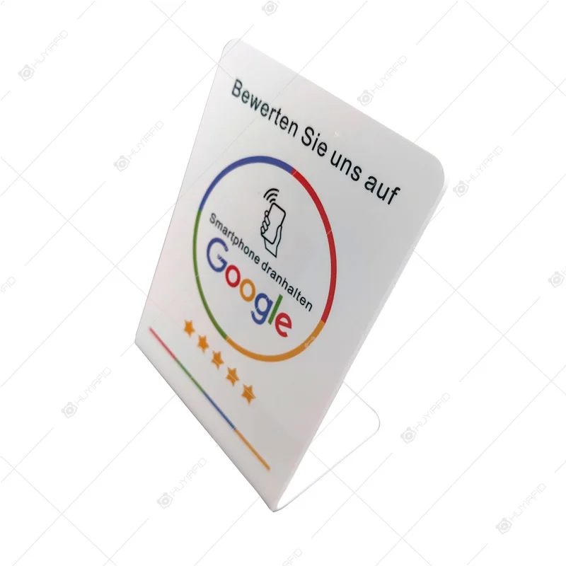 NFC counter stand with a review sign and QR code on a desktop