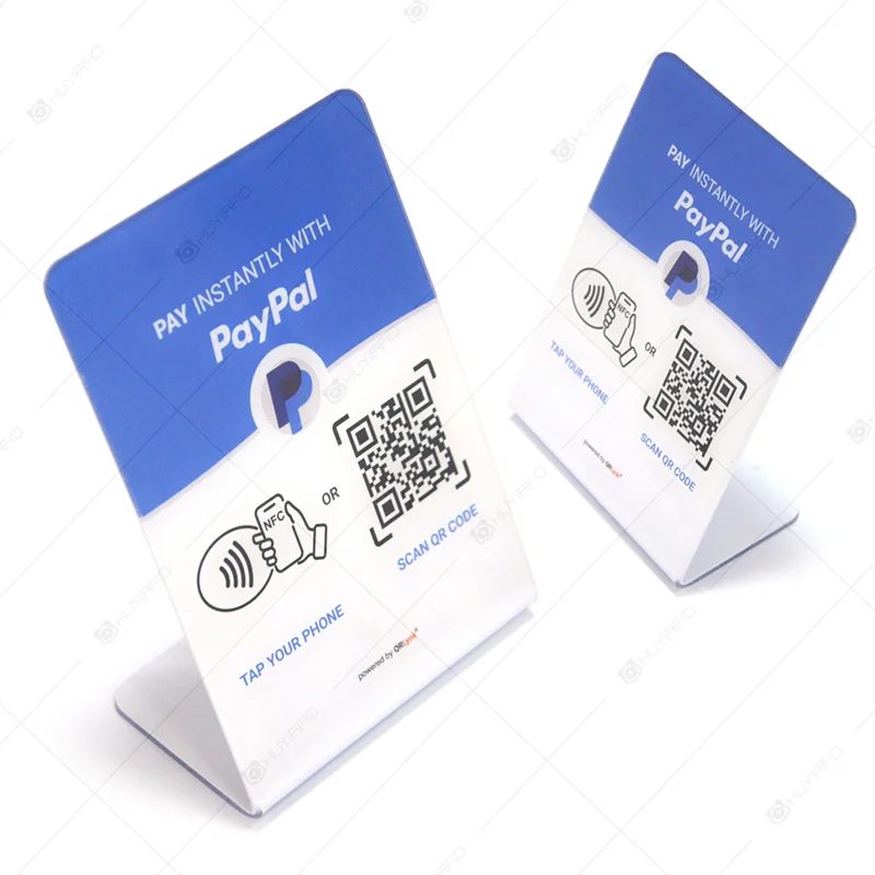 NFC acrylic stand on a counter inviting customers to tap for a Google review